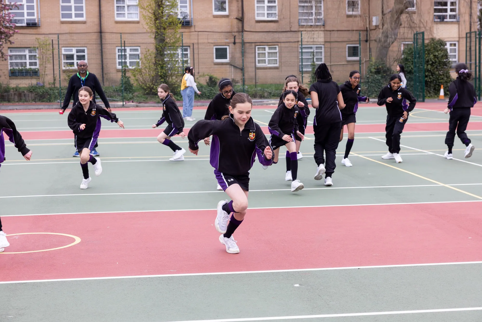 Students sitting with the Headteacher at St Michaels Catholic School in North Fincley.