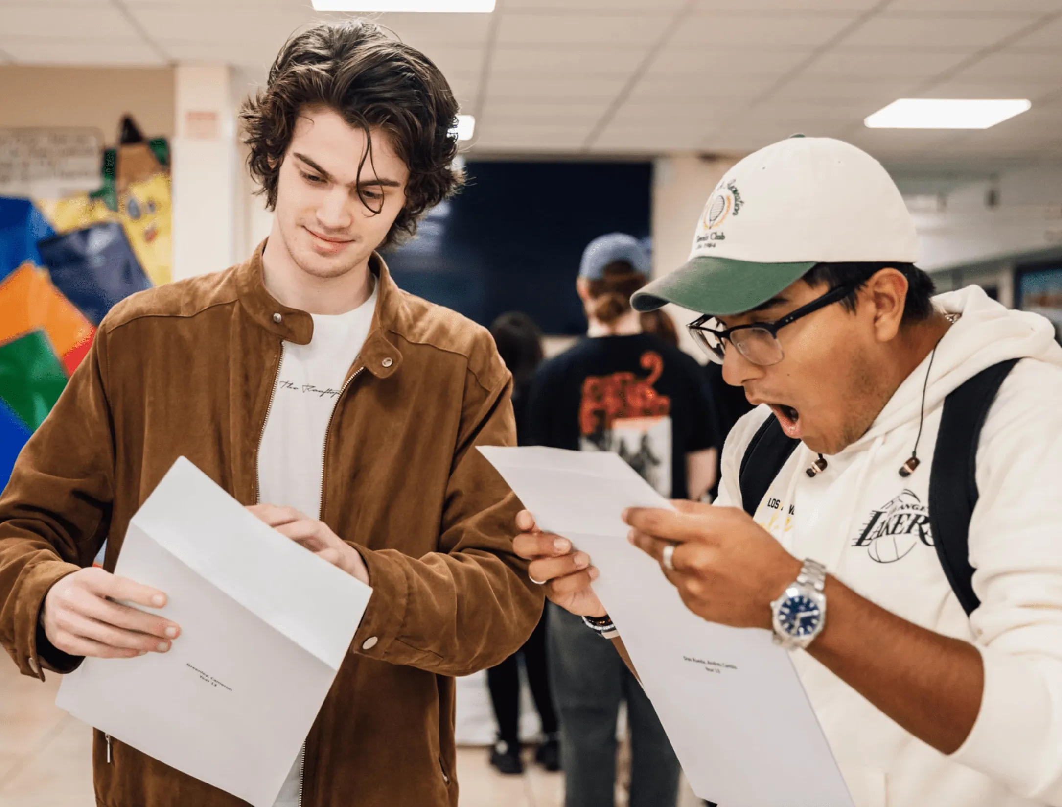 Group of secondary school pupils standing in purple uniform outside The Totteridge Academy.
