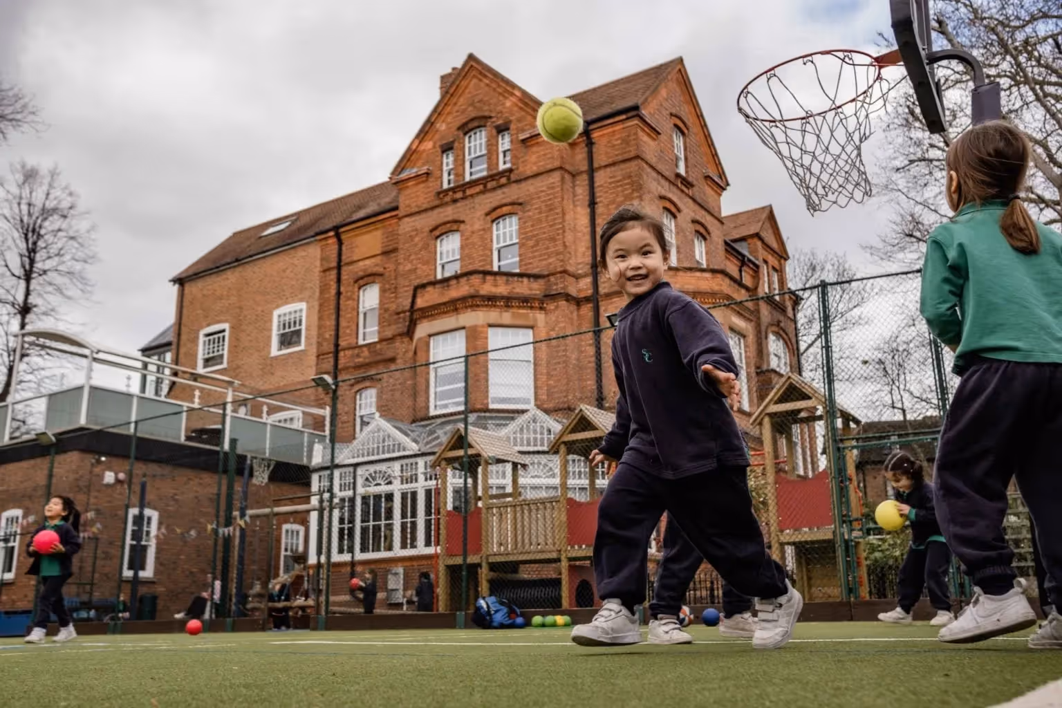 A group of young girls enjoying themselves in the playground at St Christophers in Belsize Park.