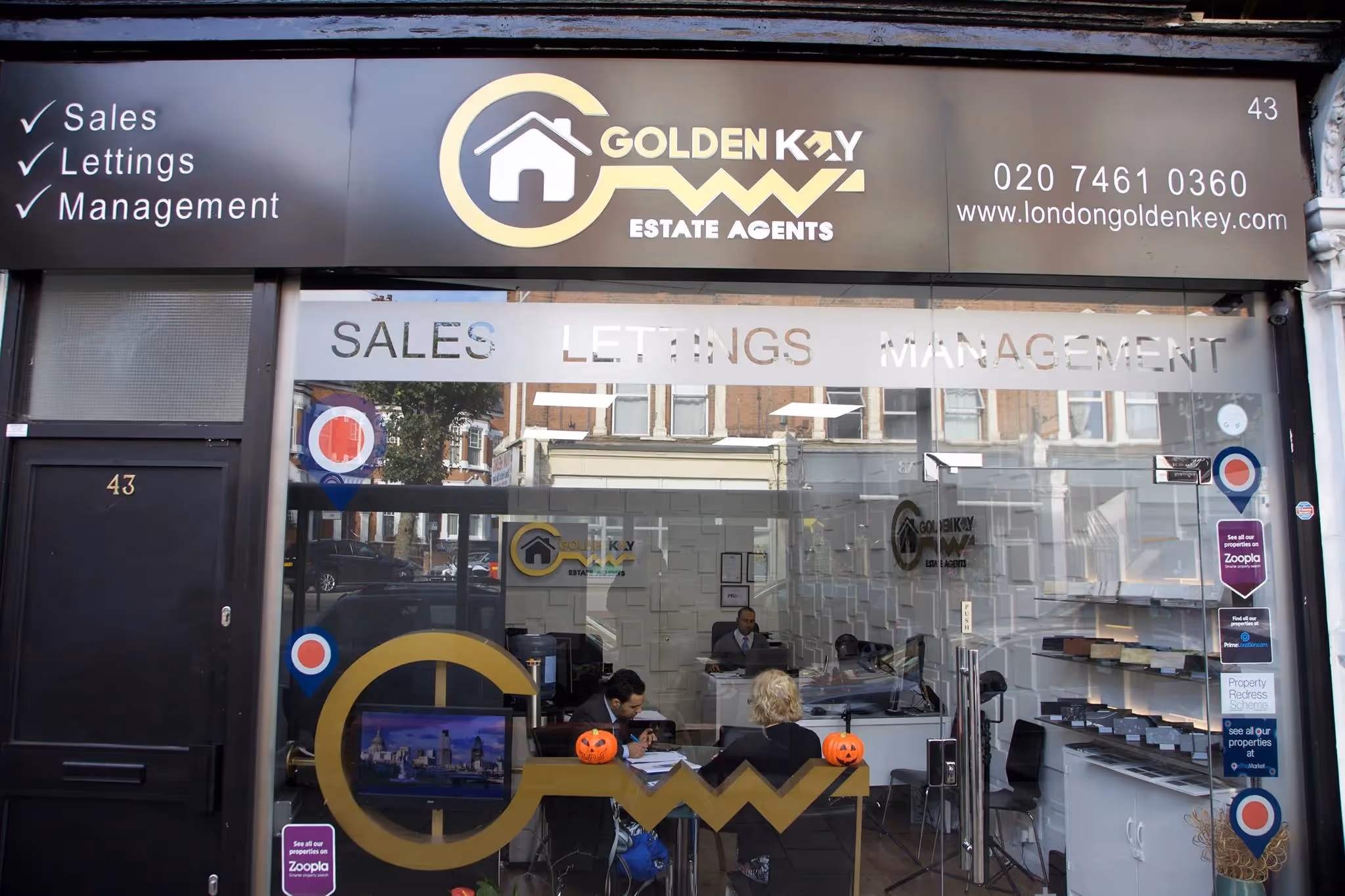 Black shop exterior for Golden Key in Kilburn.