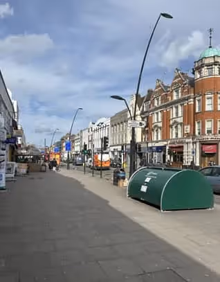 Blue shop front for North West 6 in Kilburn.
