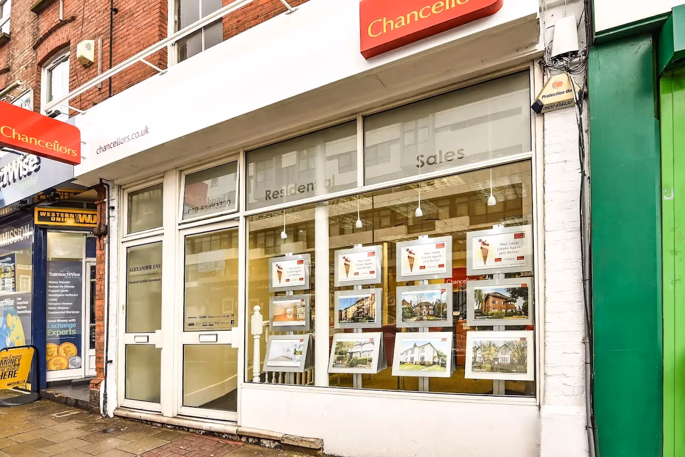 White and red shop front for Chancellors Estate Agents in Finchley.