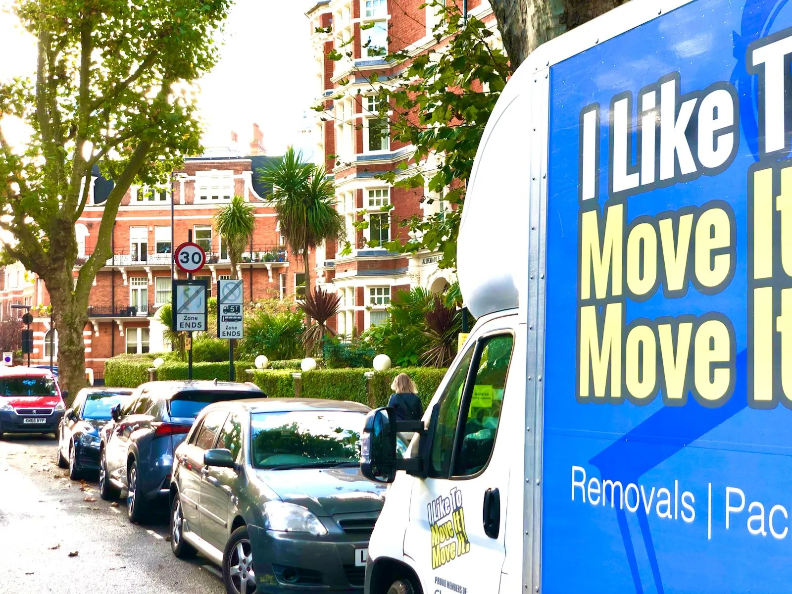 Man with Van service being performed outside block of red bricked mansion flats in Hampstead NW3 | I Like to Move it Move it