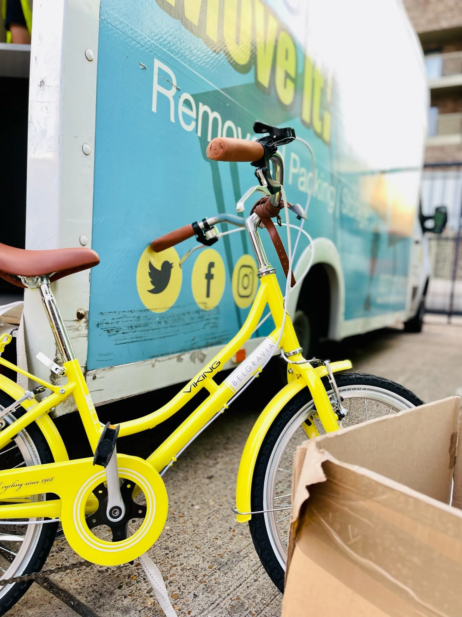 Man and Van Service loading a bicycle in Hammersmith W