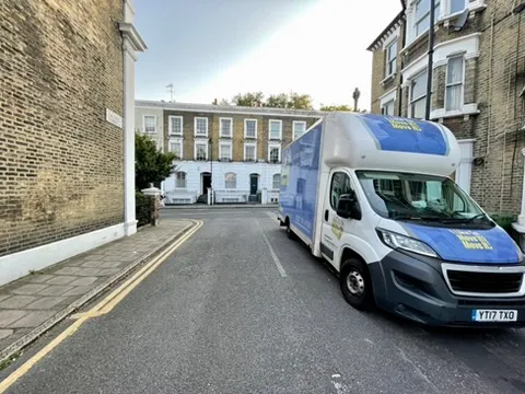 Direct man and van Holloway team loading a vehicle in N7