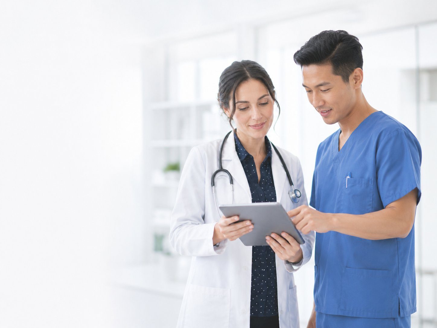 Physician reviewing clinical protocols on tablet