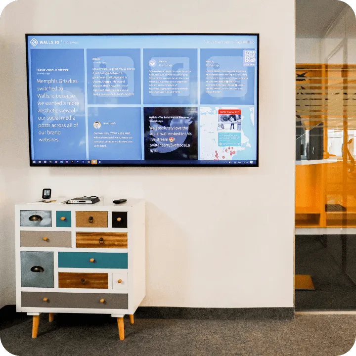 digital signage content from social media on a screen in an office