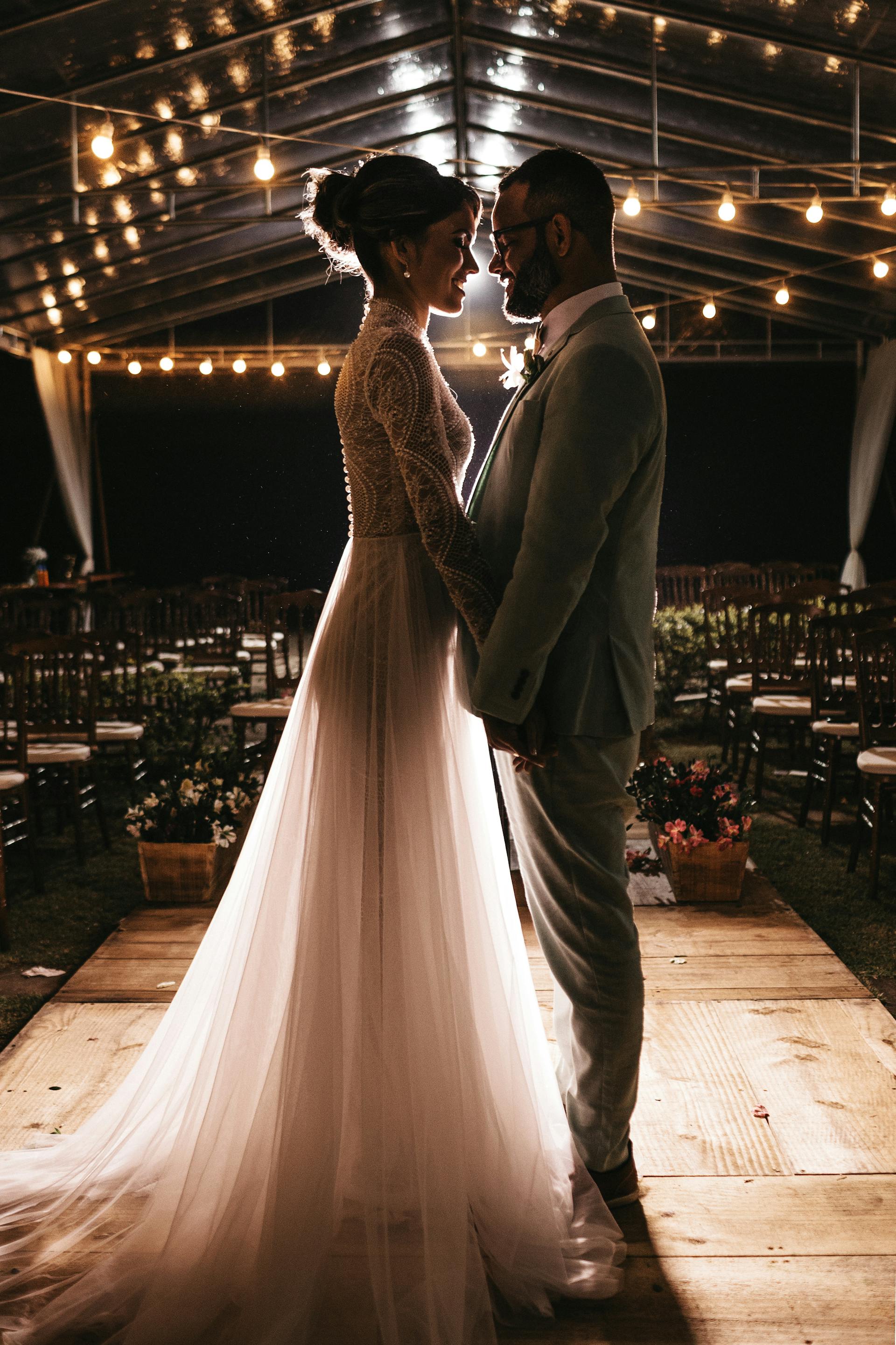 Bride and groom standing close together at a wedding venue
