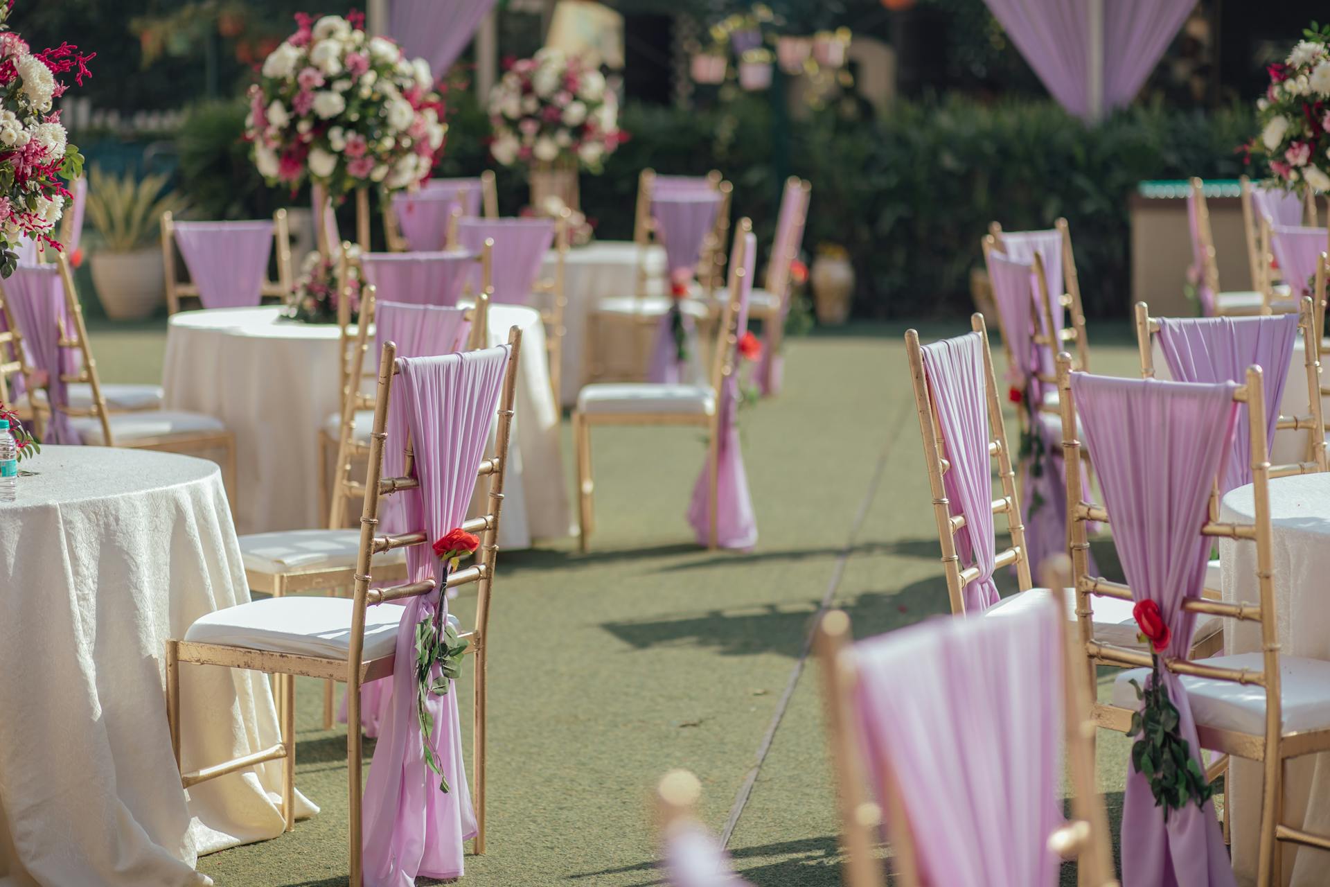 Chairs and tables set up at an outdoor wedding venue