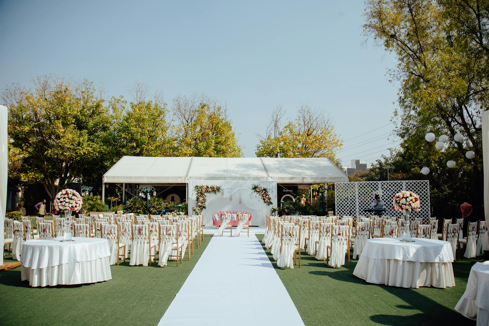 Elegant outdoor wedding setup with a white tent