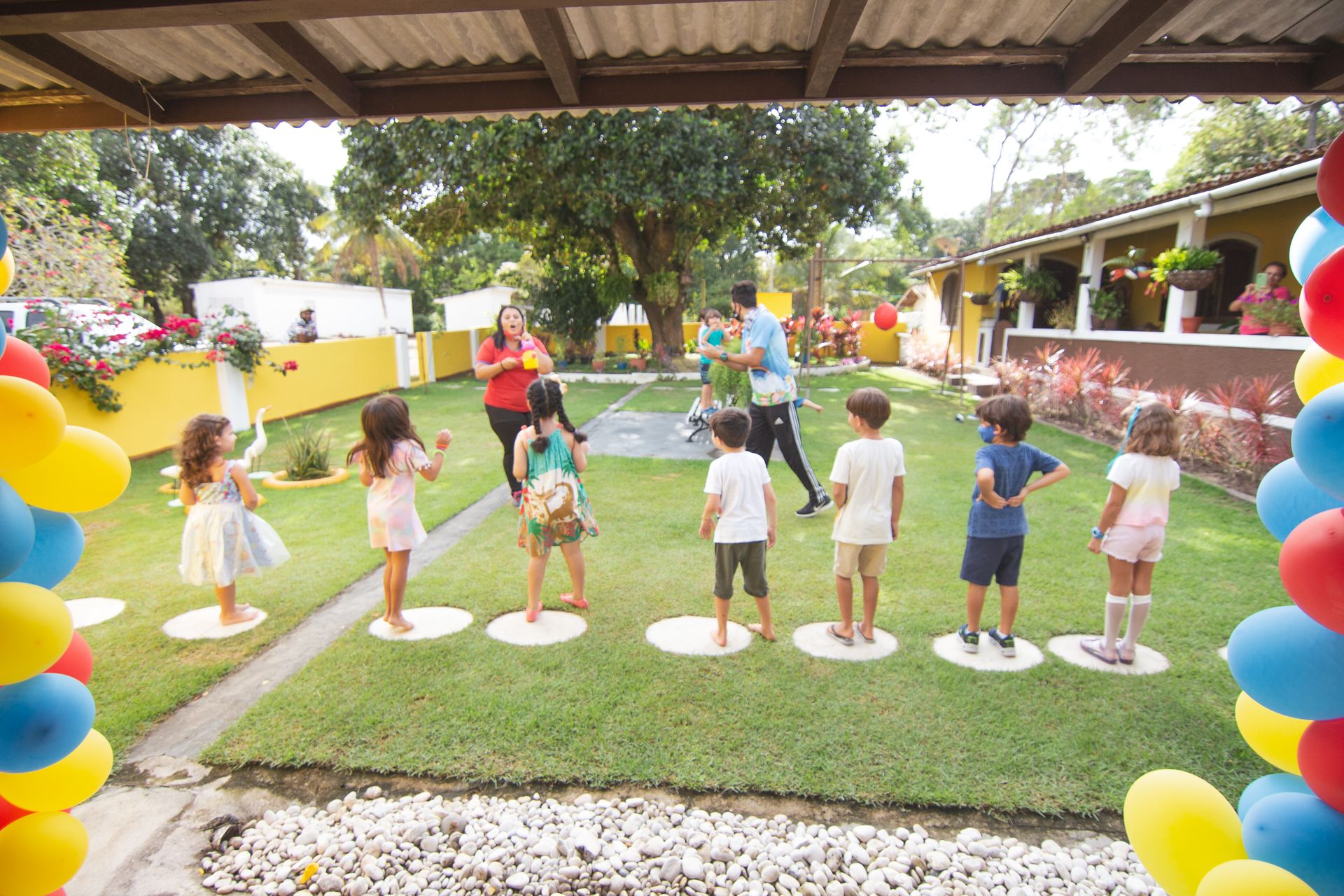 Children playing a game at a backyard party