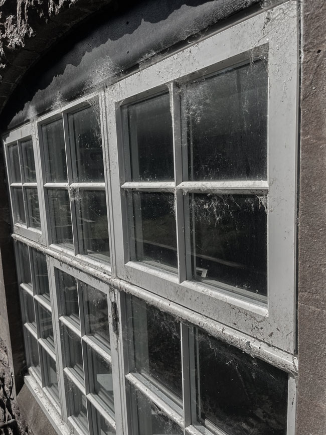 Photo of a dirty window on a house in Cheddar, Somerset before it has been cleaned by Window Genie's Professional window cleaners.