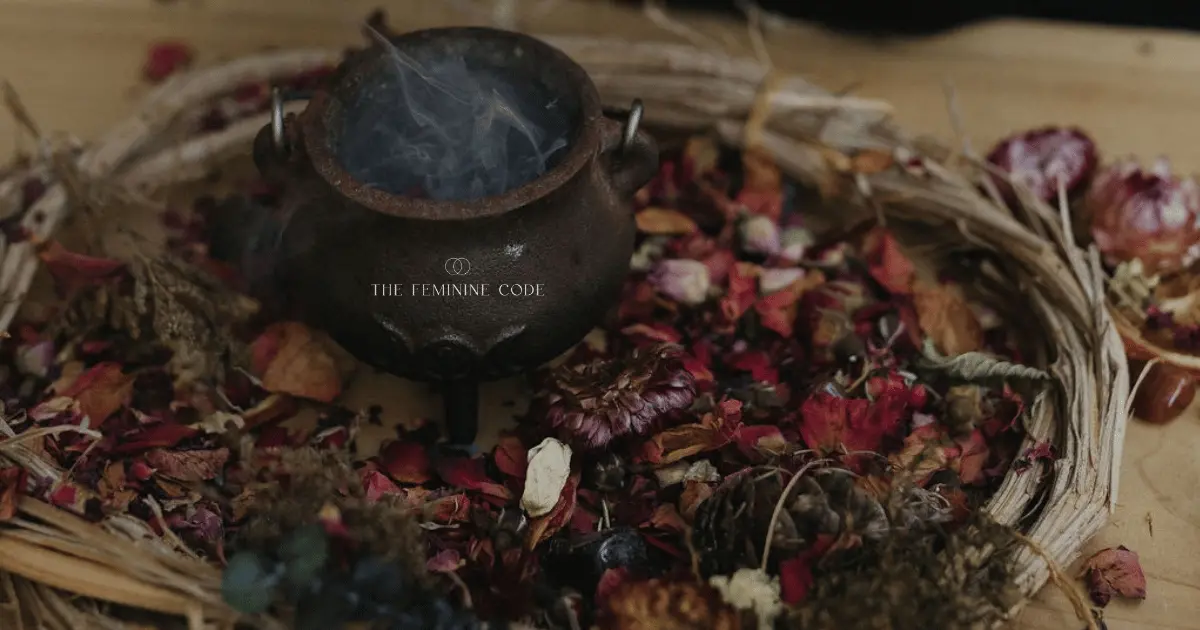 A Harvest Beauty Altar with autumnal dried petals stones leaves and an incense cauldron with smoke rising out of it
