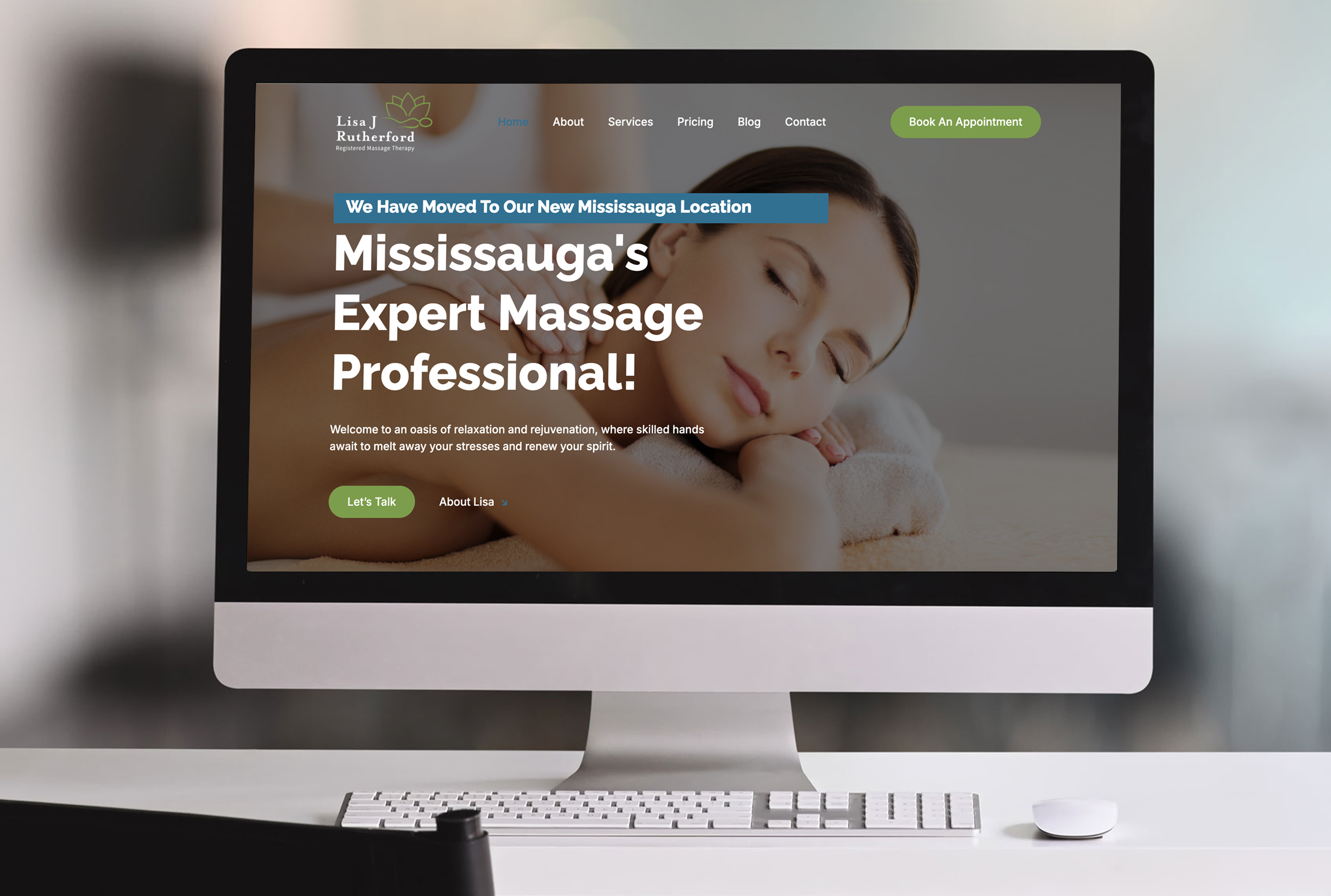 Desktop computer displaying the homepage of Lisa J Rutherford Registered Massage Therapy website. The screen features a banner with a woman peacefully receiving a massage, a headline announcing the new Mississauga location, and a call-to-action that reads 'Mississauga's Expert Massage Professional!' Navigation links and booking buttons are visible at the top.