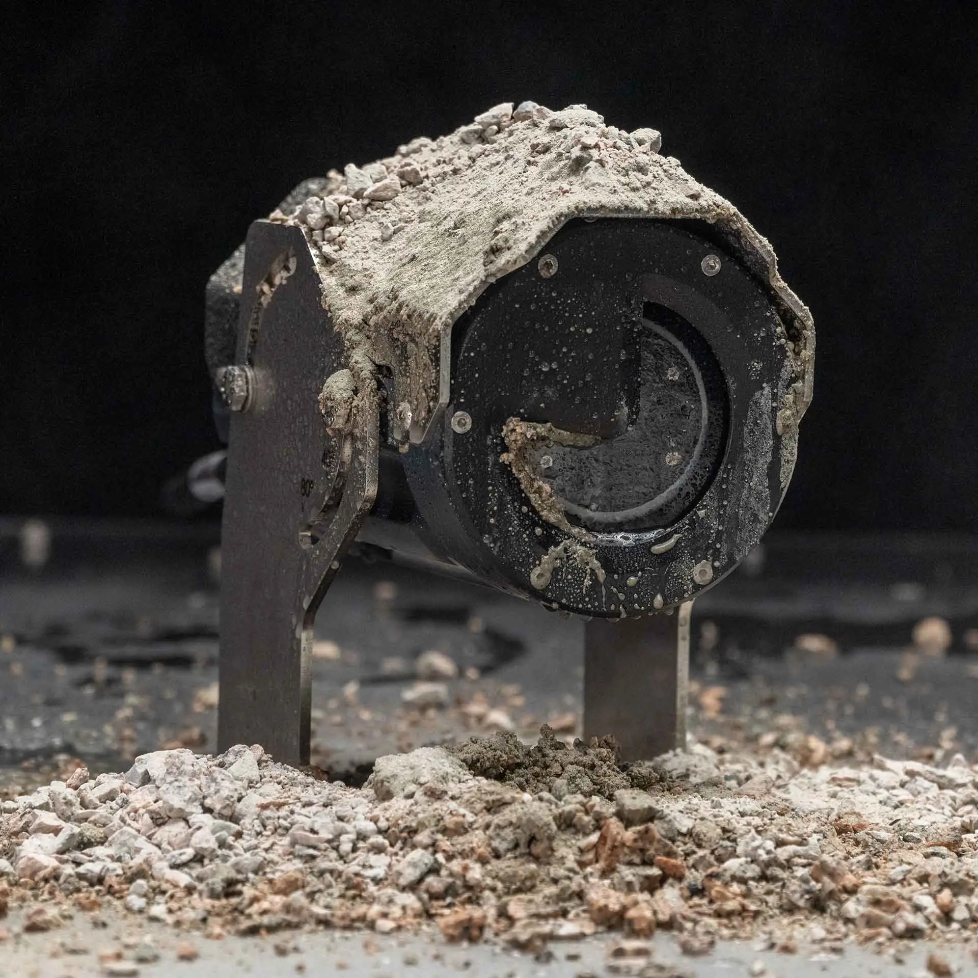 A ToughEye camera covered in dirt, but with a clean lens after a cleaning cycle