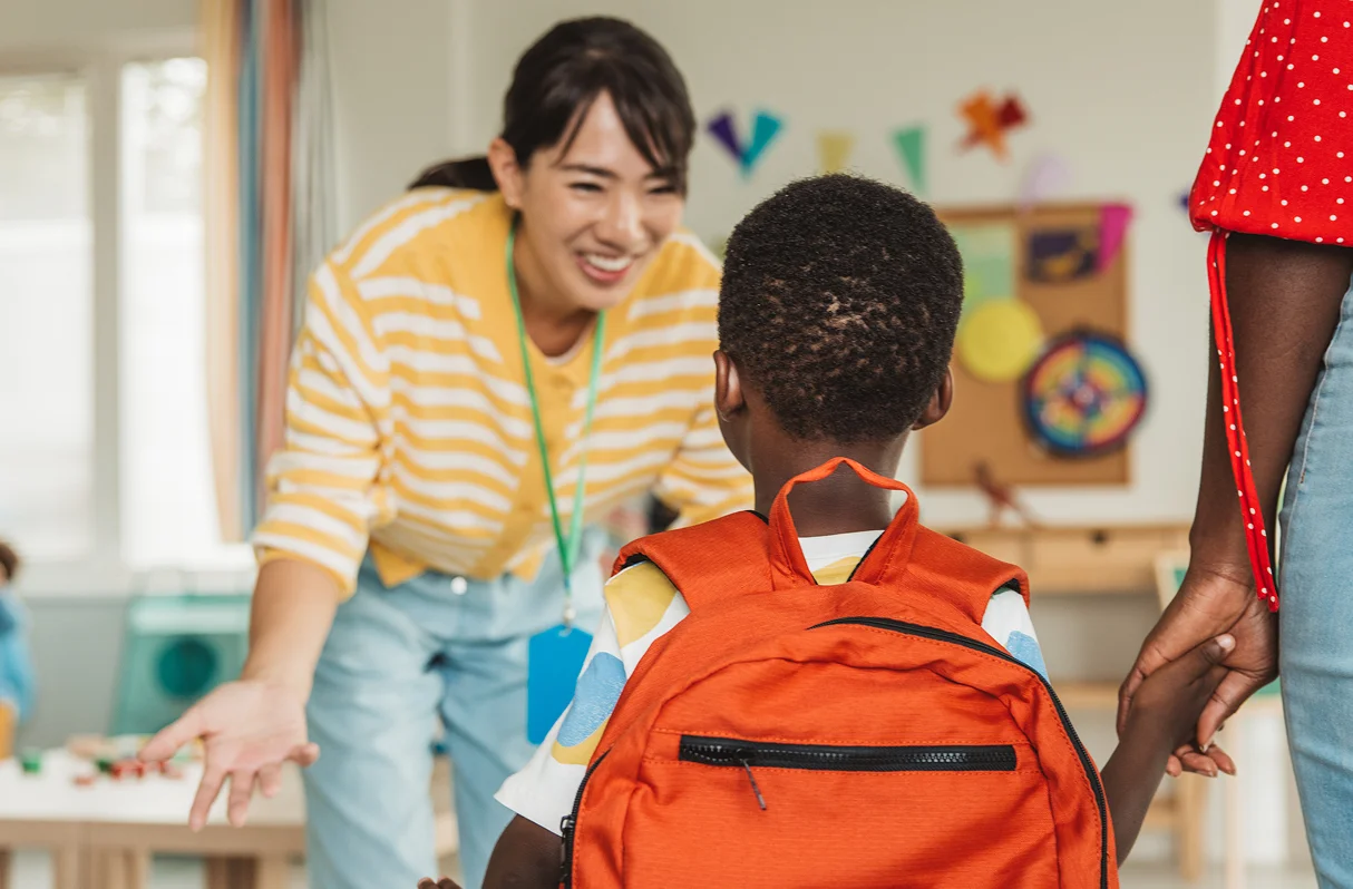 Provider greeting a student and their parent