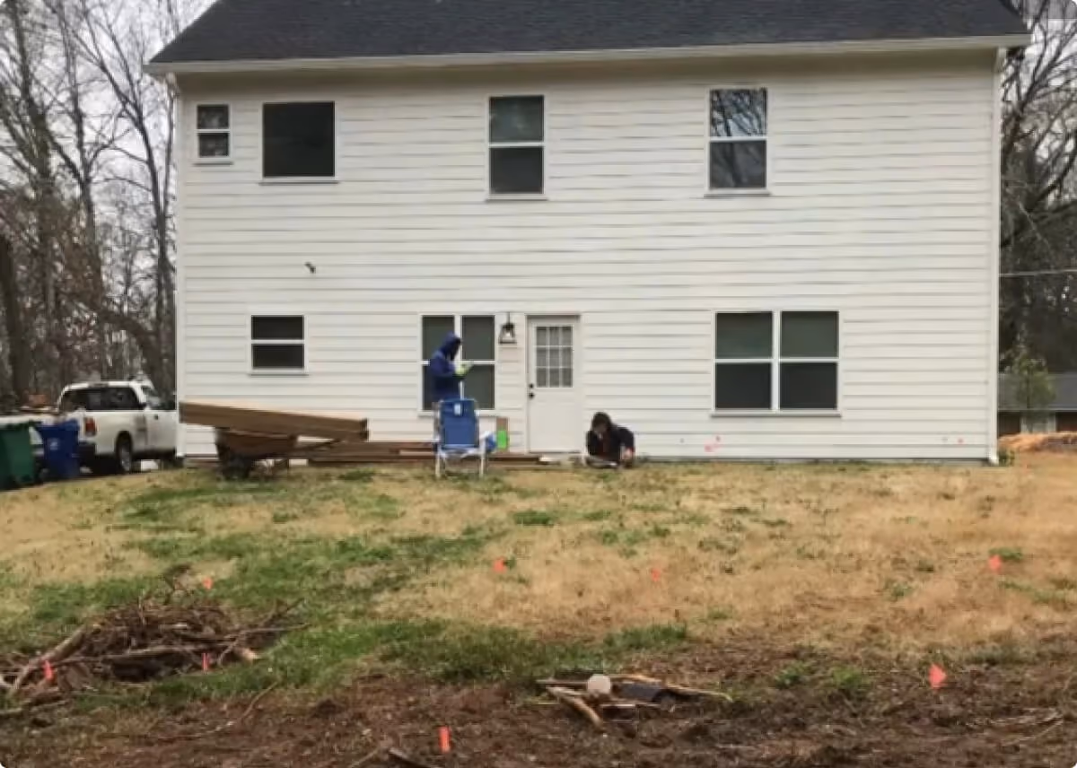 A photo of a house with an average lawn and the words "before"
