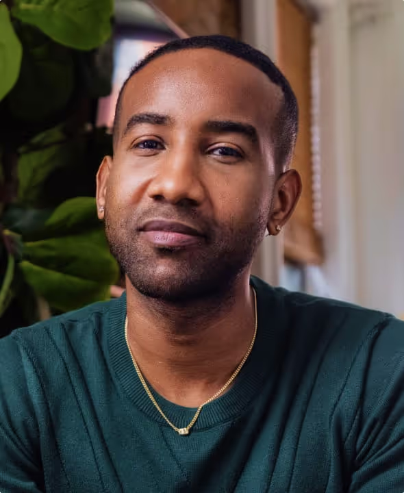 Portrait of Carlvin, real Talkspace member, inside apartment setting