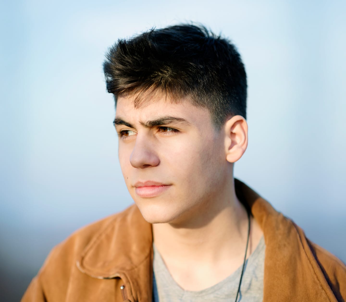 Young man with brown jacket