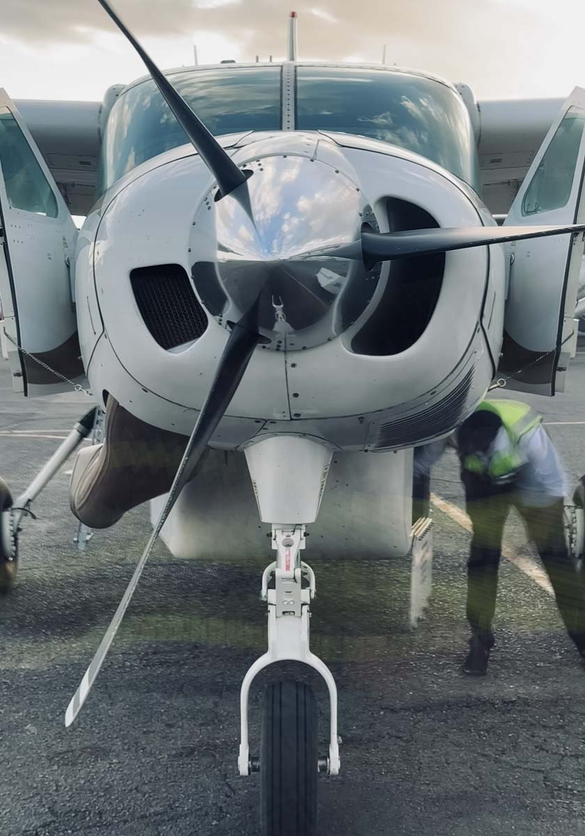 A small propeller plane on the airstrip