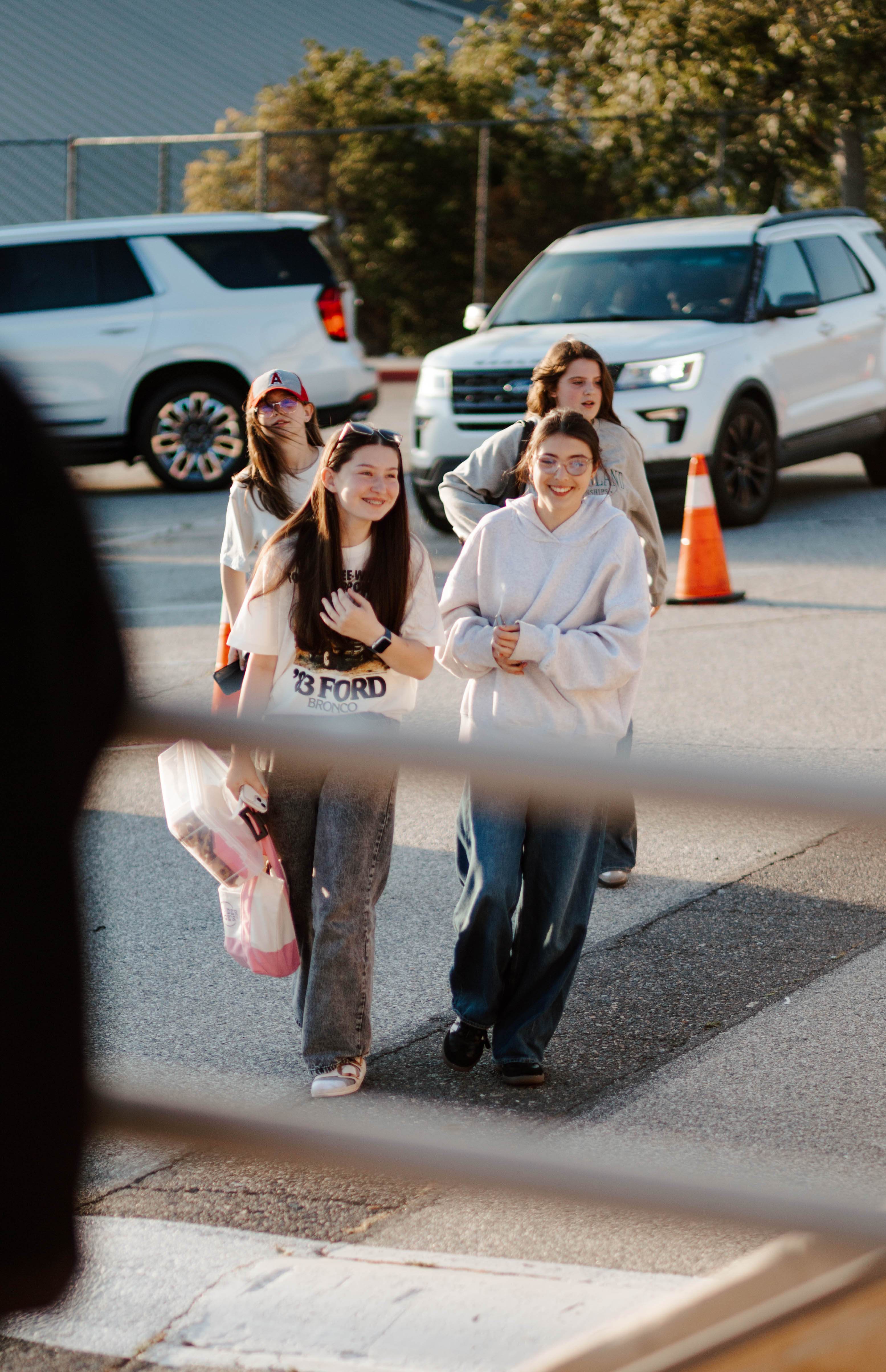 Friends Students arriving together at an outdoor event