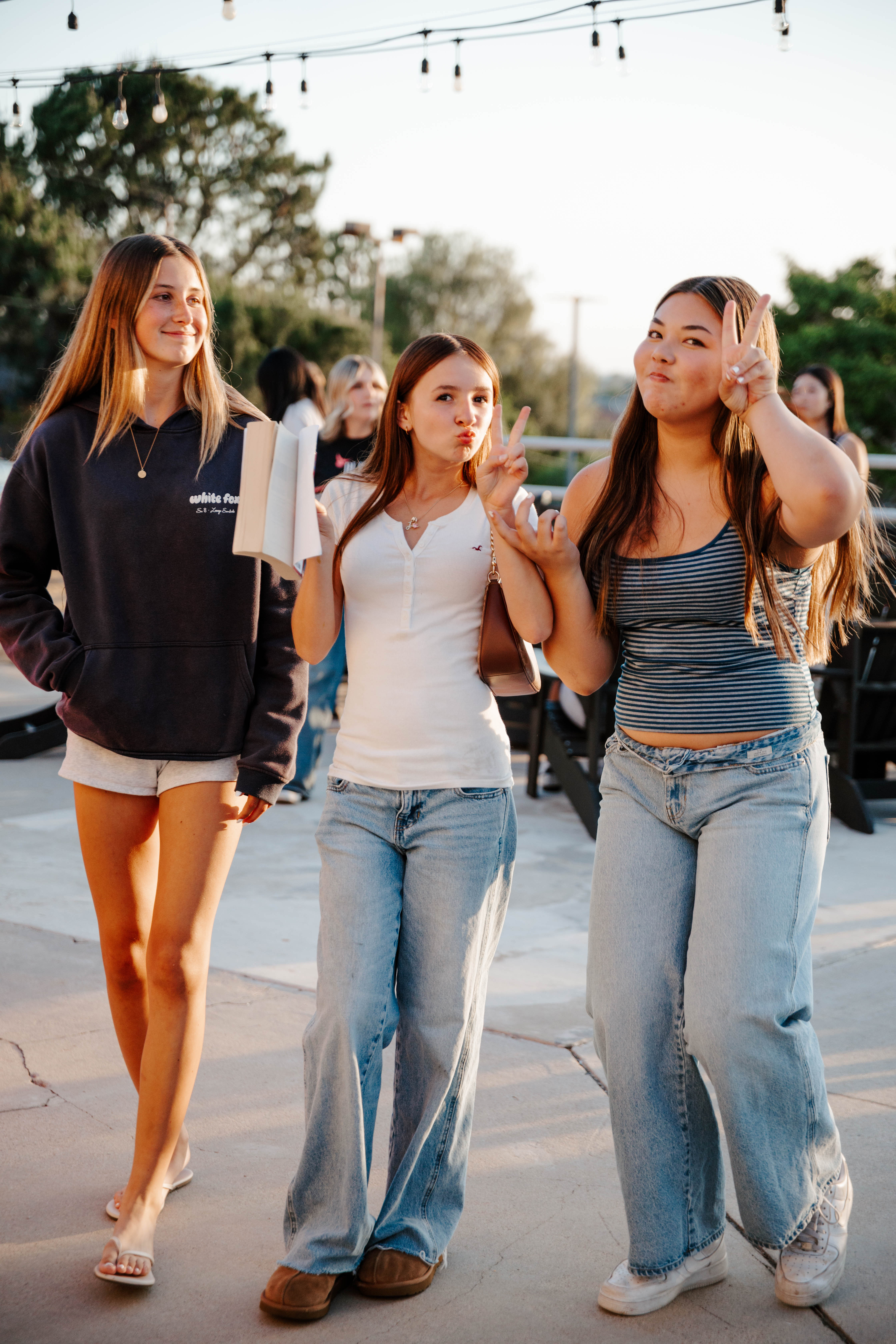 Friends Students walking and laughing together outdoors