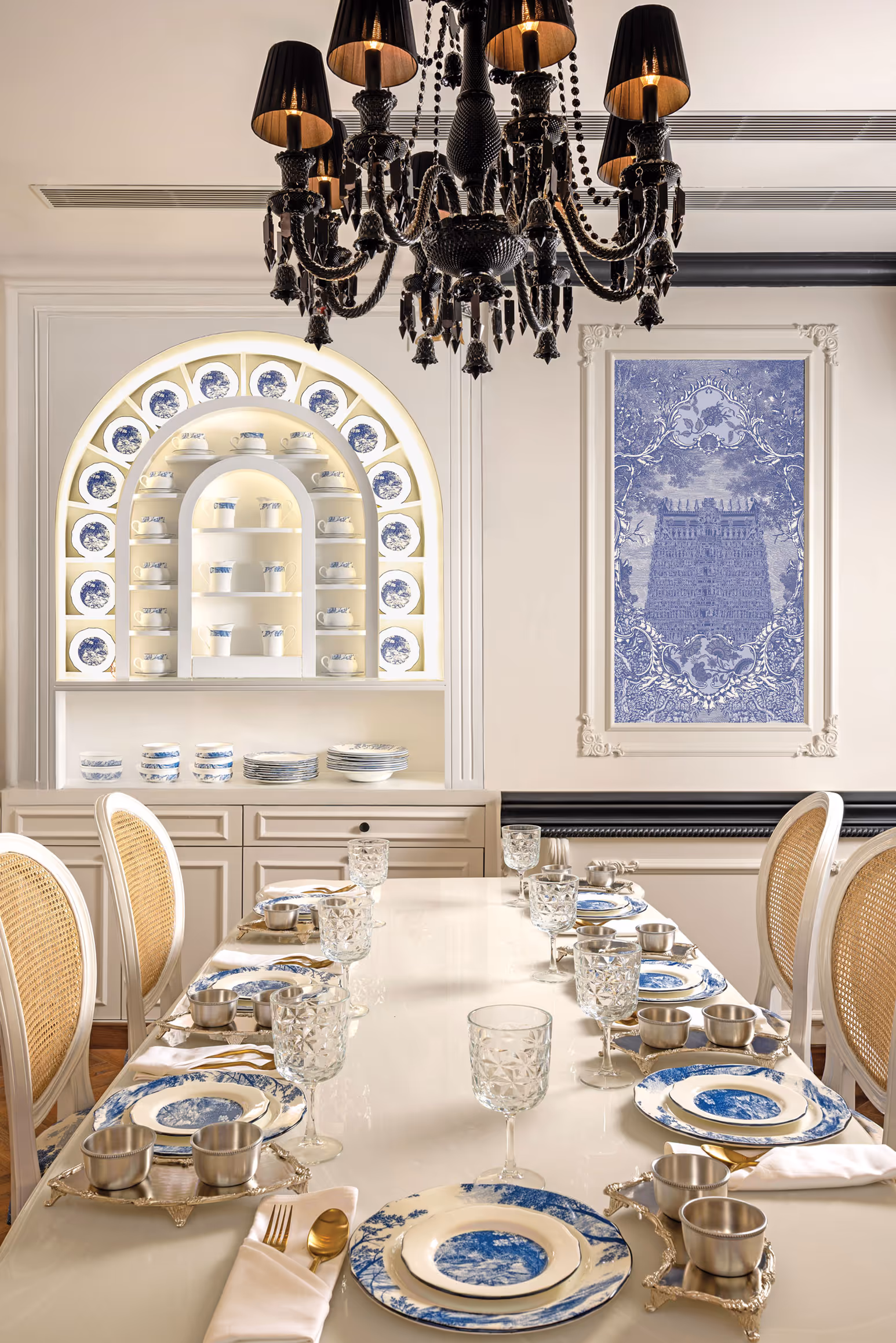 Crockery illustration and interior styling by KRT Design Studio, featuring a refined blue-and-white porcelain table setting with illustrated plates, curated serveware, and an English-classical dining environment that reflects meticulous craftsmanship, heritage-inspired design, and contemporary luxury dining aesthetics.
