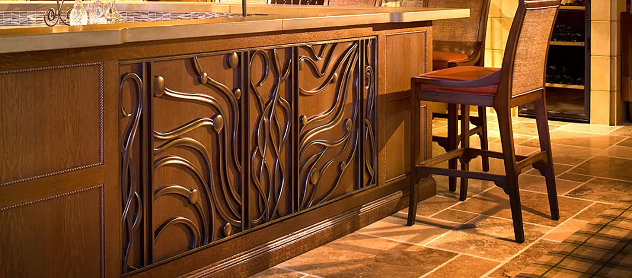 A beautiful custom wave pattern architectural grille designed for a home bar