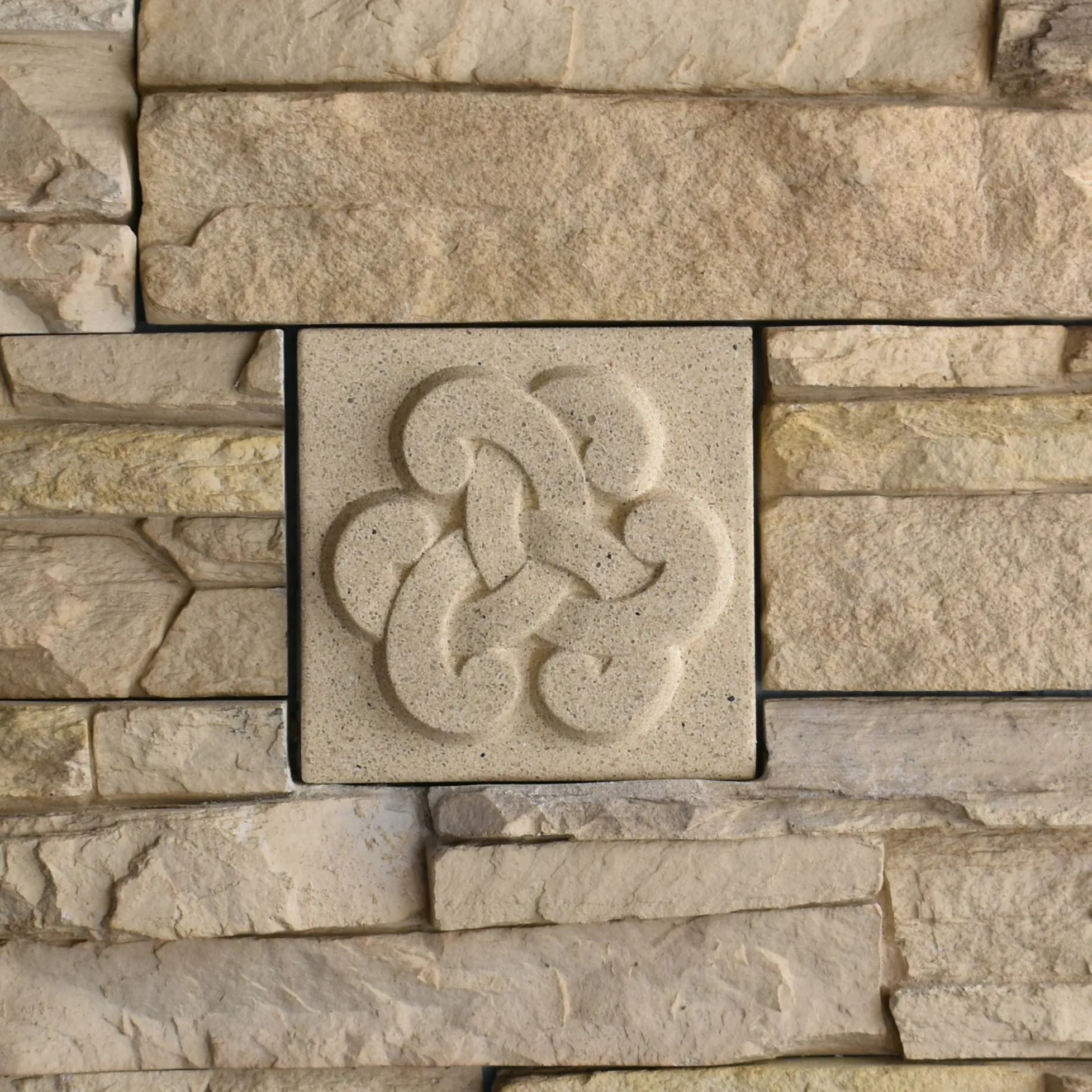 Open Loop Bas-Relief Cast Stone Masonry Insert Wall Accent by Pineapple Grove Designs
