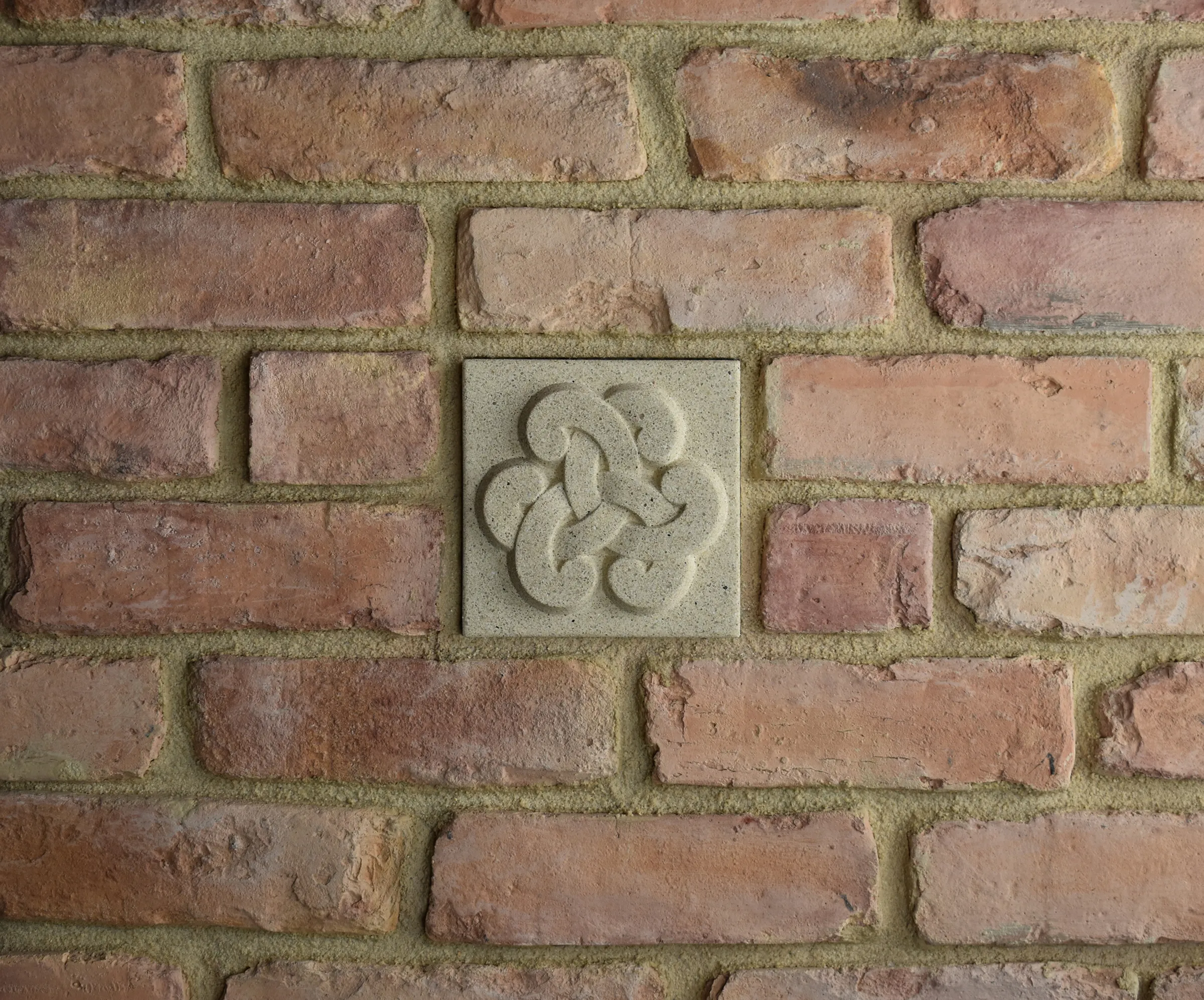 Open Loop Bas-Relief Cast Stone Masonry Insert Wall Accent by Pineapple Grove Designs