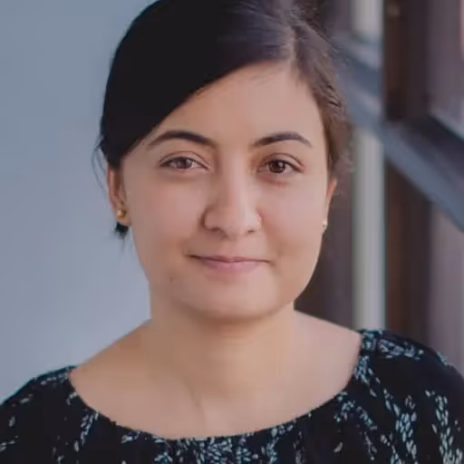 A woman with a black shirt and a gold earring. - Assistments - Formative Assessment Solutions