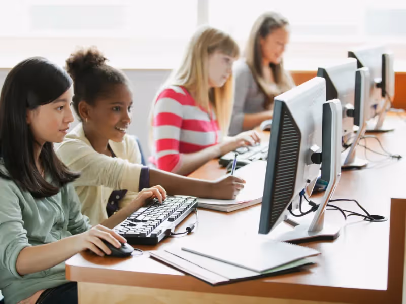 A group of girls working on computers. - ASSISTments Images