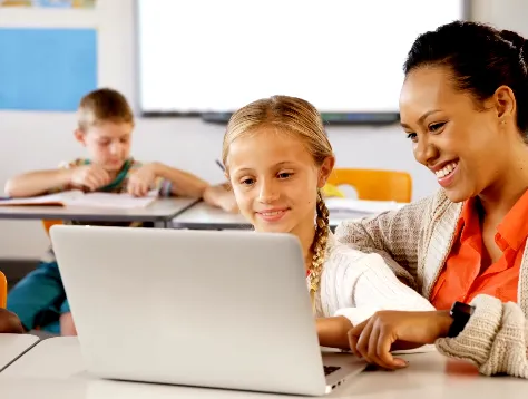 A woman and a girl are using a laptop. - ASSISTments Images