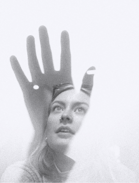 Photo of Breanna looking upwards overlayed with a silhouette of a hand