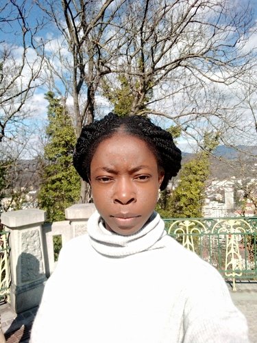 A headshot of Adenike Oladosu