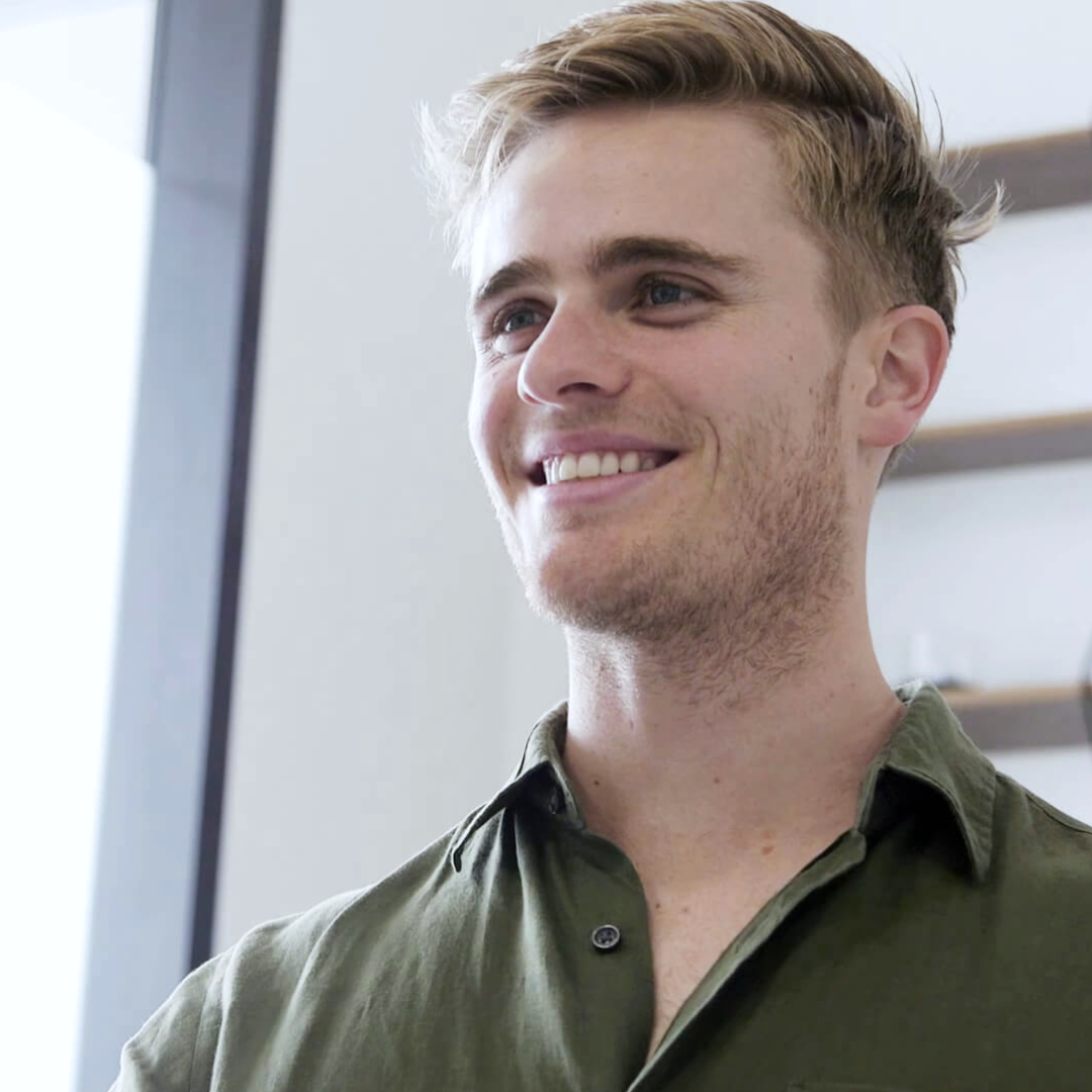 Young male patient smiling after dental appointment at le tooth