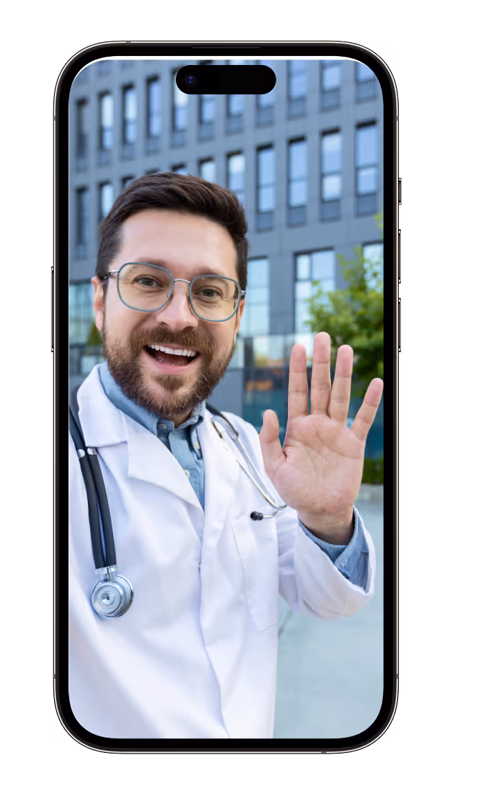 A man in a lab coat and glasses making a hand gesture.