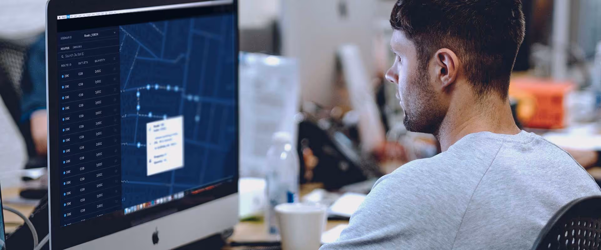 Operations manager working with FlexOps Command on desktop computer