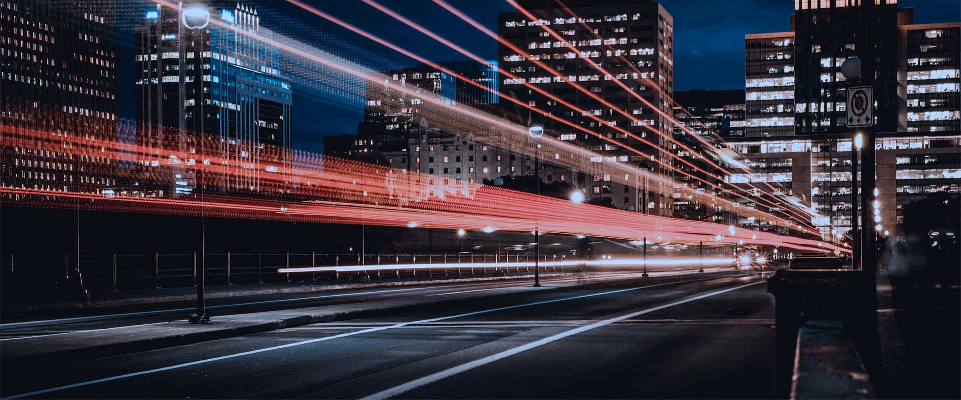 Long exposure of cars and traffic against night time city backdrop