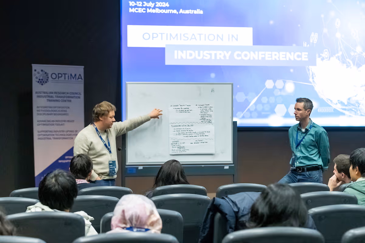 Adiona CEO Richard Savoie presenting to an audience at the OPTIMA Optimisation in Industry Conference 2024.