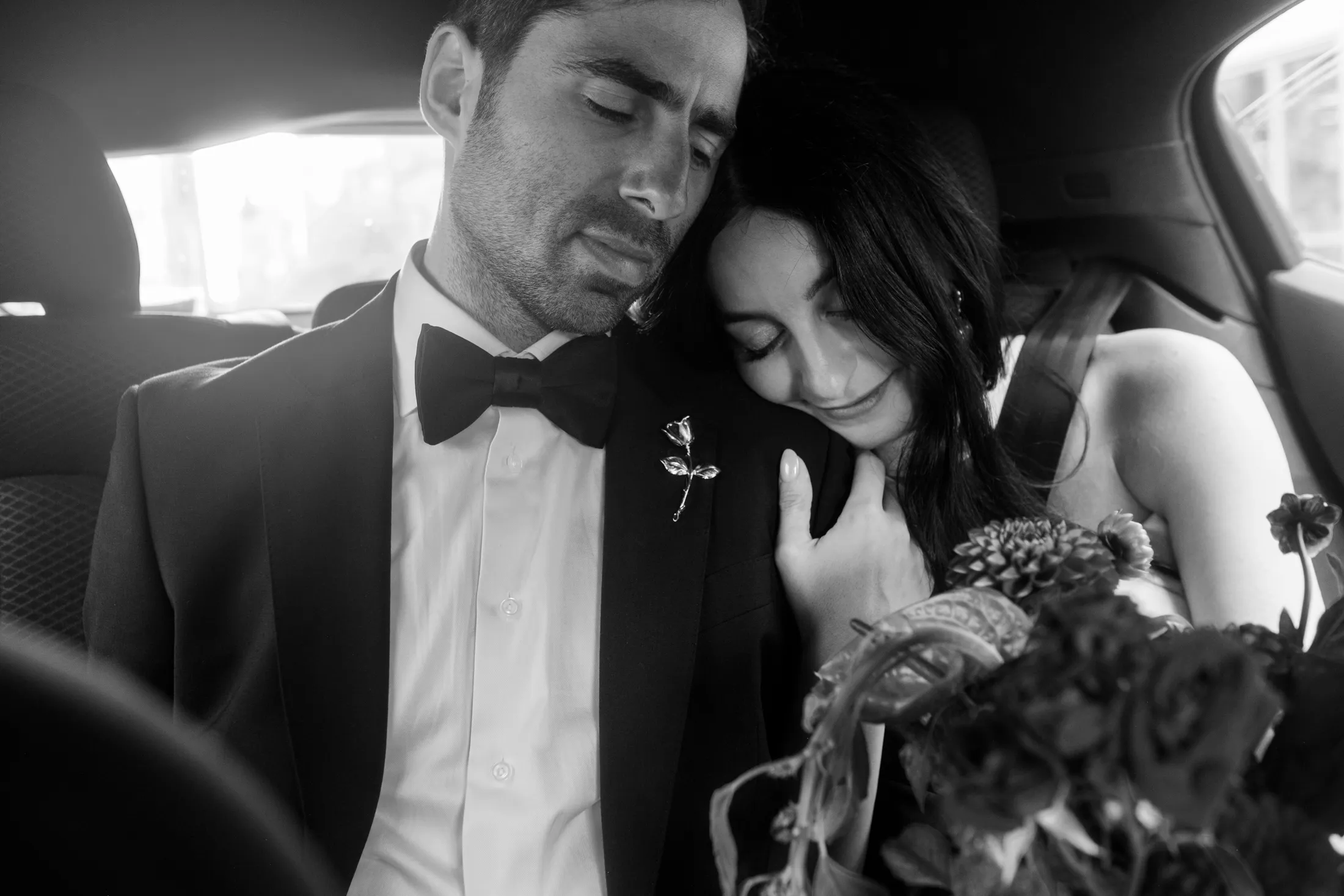 bride and groom in car after st-henri wedding ceremony