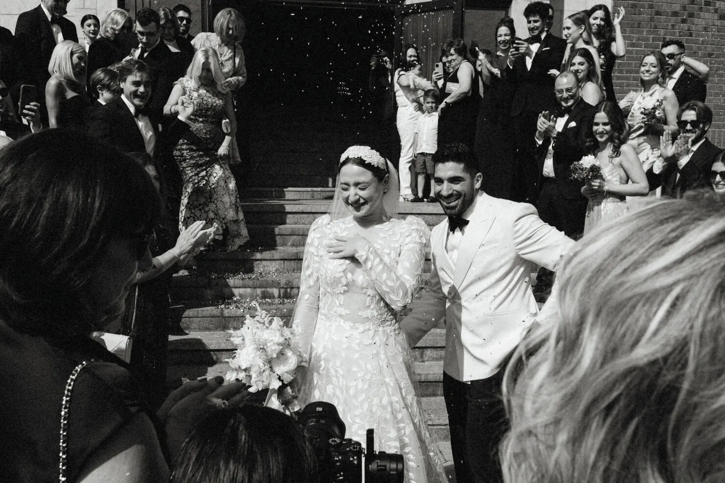 engaged couple laying in grass at the Ottawa Dominion Arboretum photo session
