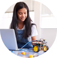 Kid works on robotics