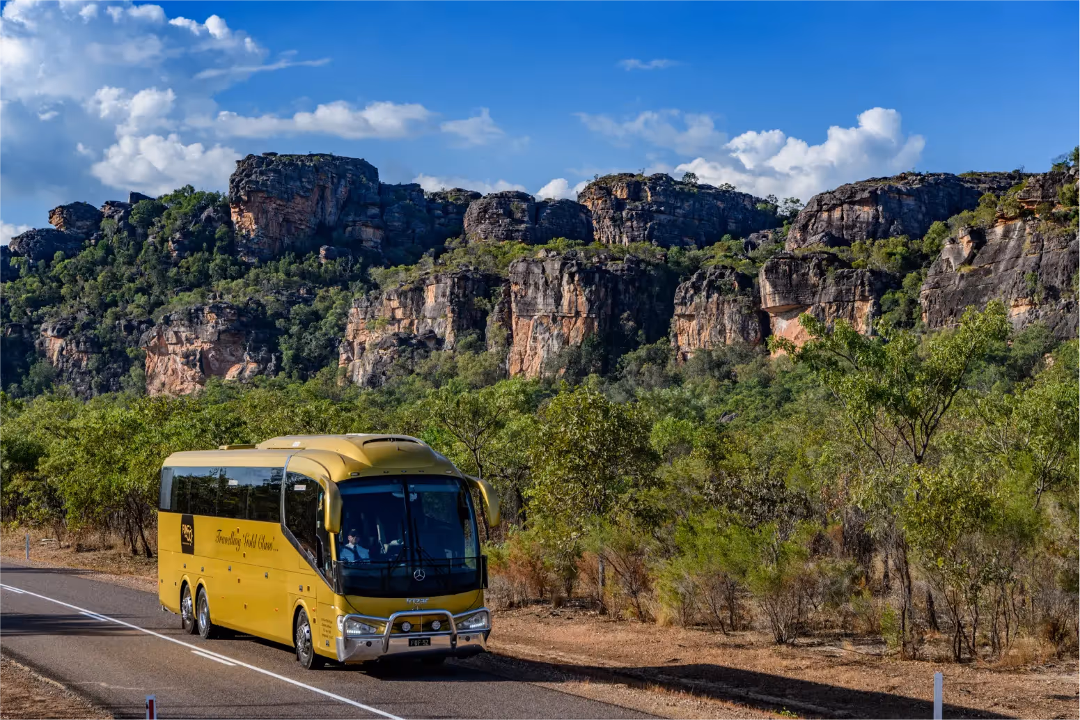 A tour bus travelling through Kakadu National Park
