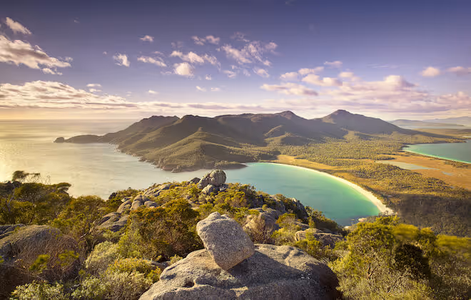 Pink mountains, white beaches, and blue bays