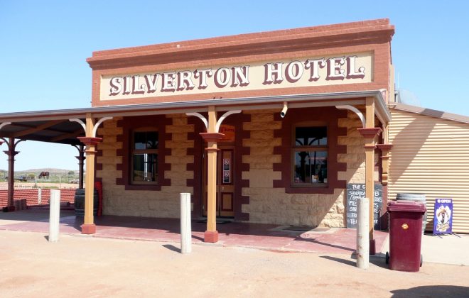 Historic façade of the Silverton Hotel under a clear blue sky.