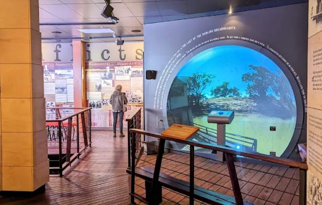 Interior of the Back O’ Bourke Exhibition Centre with interactive displays and a circular projection screen.