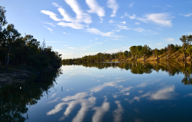 Darling-Baaka River reflecting the blue sky and clouds at sunset.