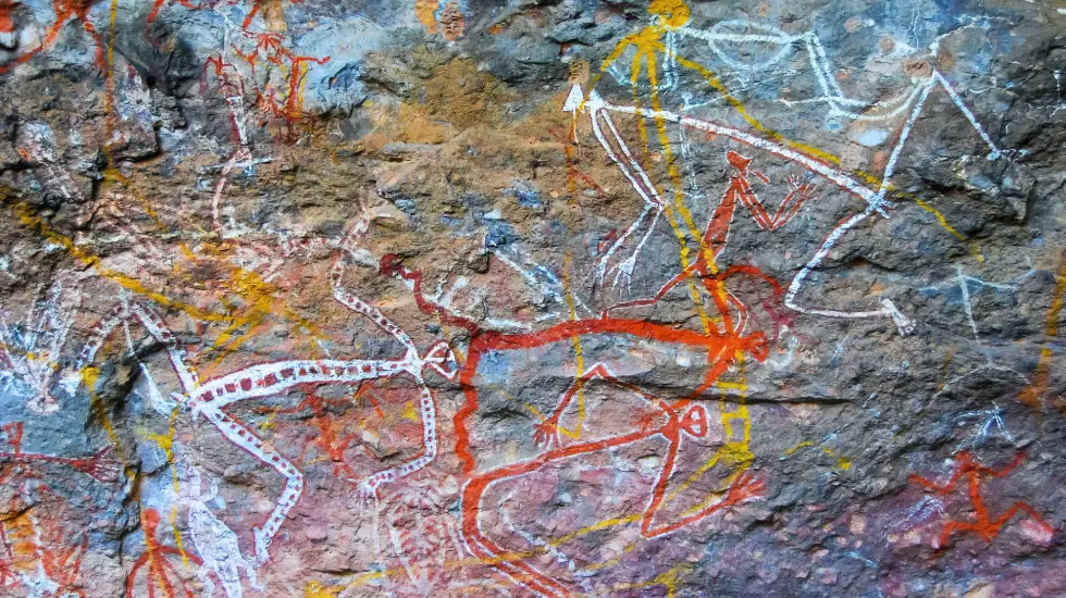 Aboriginal rock art at Burrungkuy Nourlangie in Kakadu National Park, showing ancestral figures painted in white, red and yellow ochre.