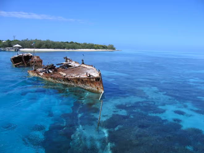 Heron Island on the Great Barrier Reef with shipwreck and crystal-clear water, ideal for solo travel over 50s.